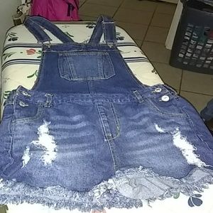 A denim, ripped jumper